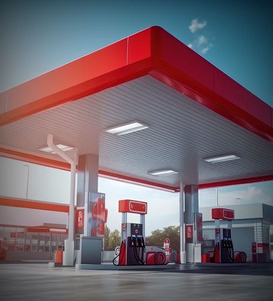 Station-service moderne avec des pompes &agrave; essence et un branding rouge vif